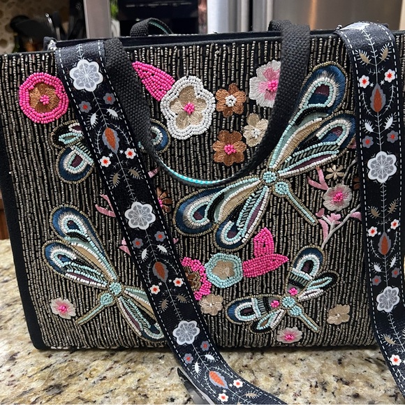 America and beyond crossbody tote is a
perfect addition to your collection. 💕 - Picture 1 of 9